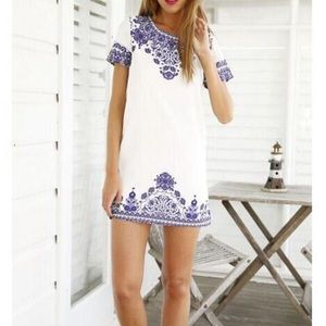 White dress with purple detail